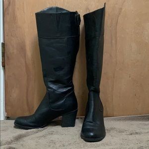 Black vegan leather knee high boots.
